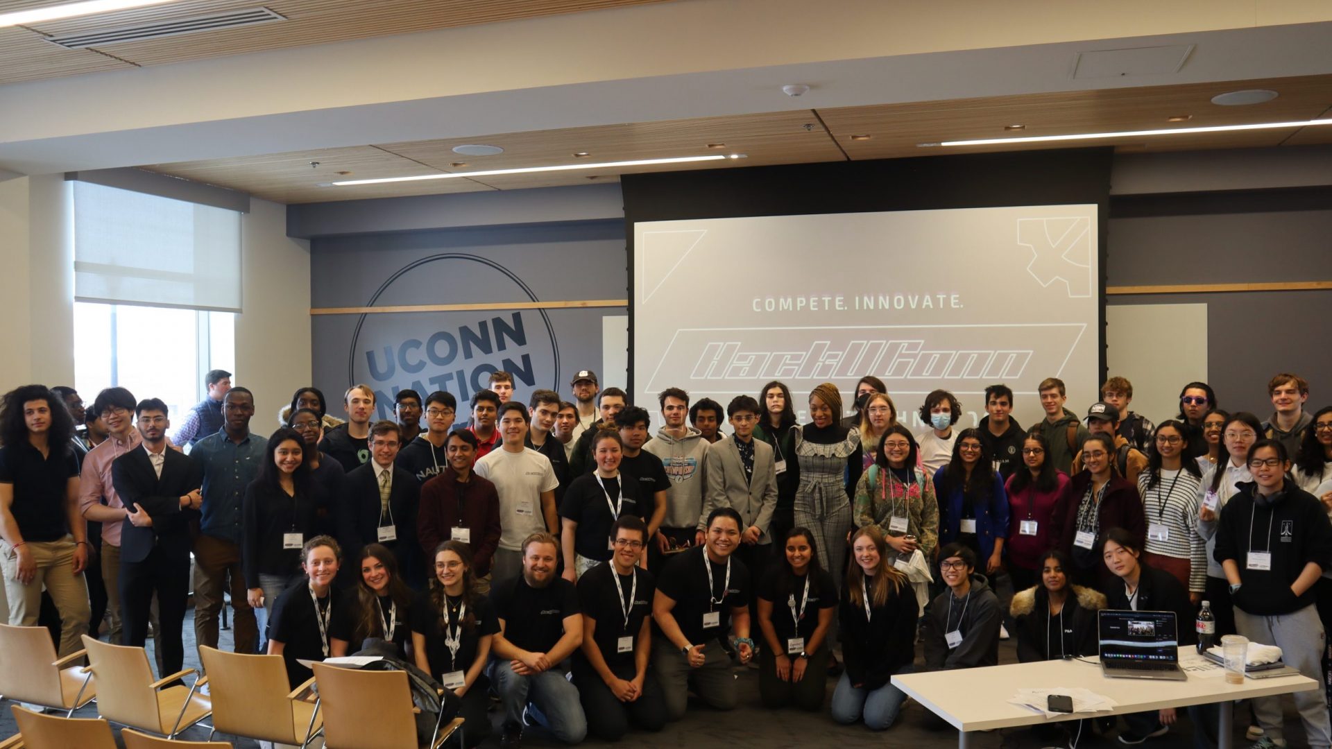 All teams at HackUConn pose for a photo at the end of the awards ceremony.