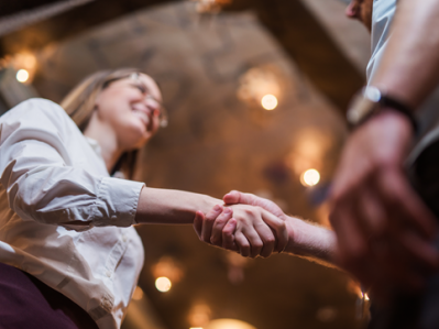woman shakes hands with man