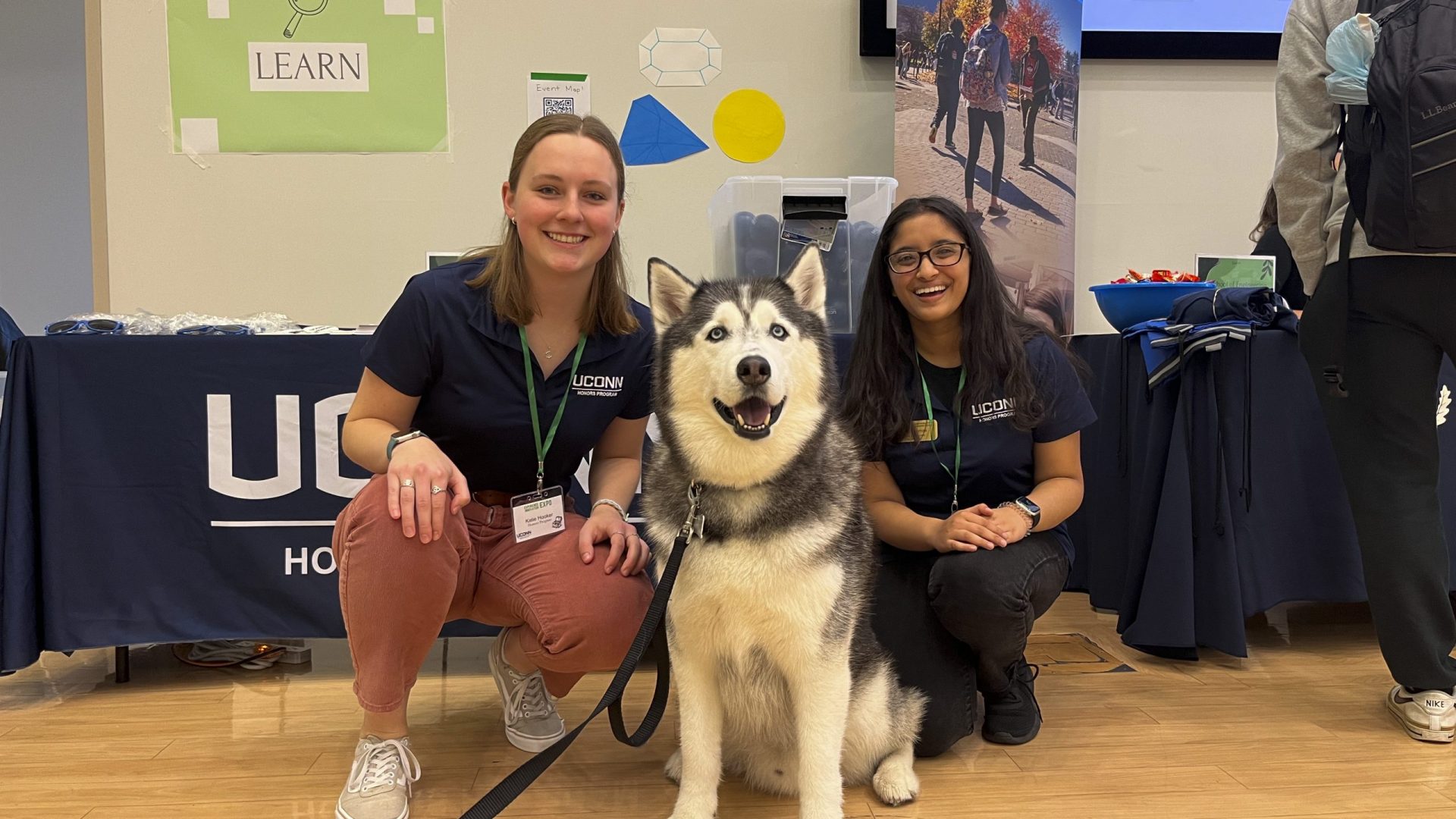 Students posing with Jonathan The Husky